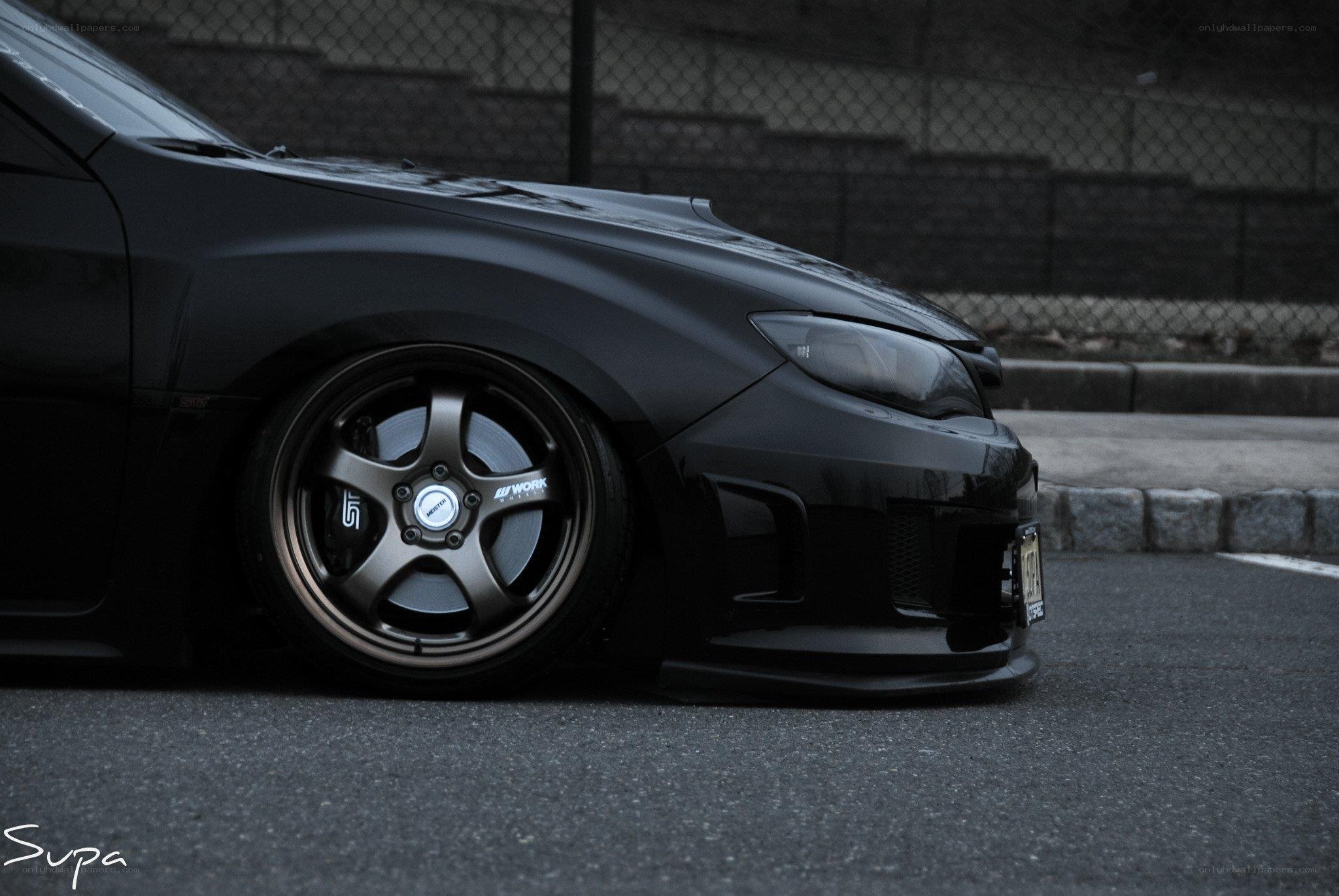 black car with custom wheels
