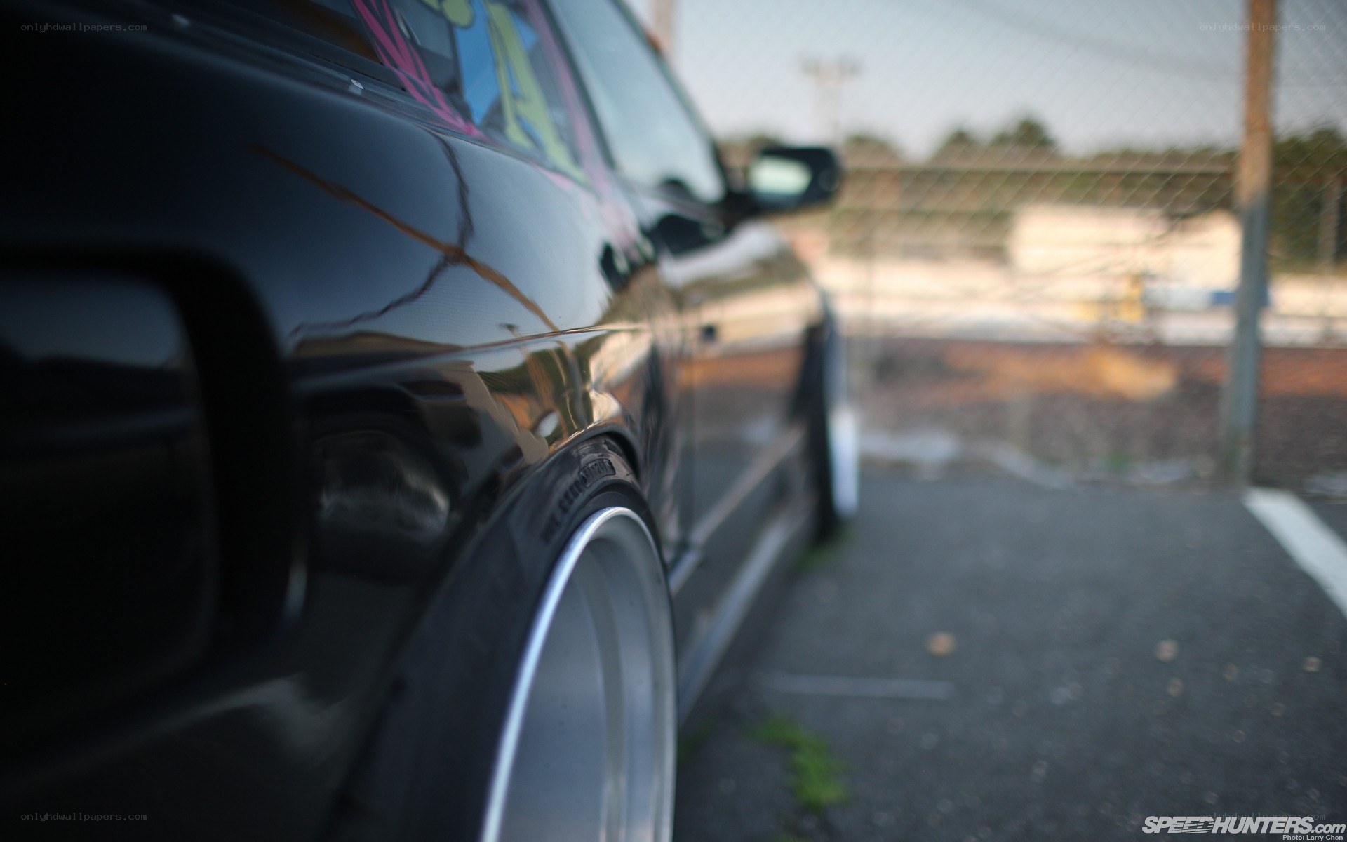 black car with custom wheels