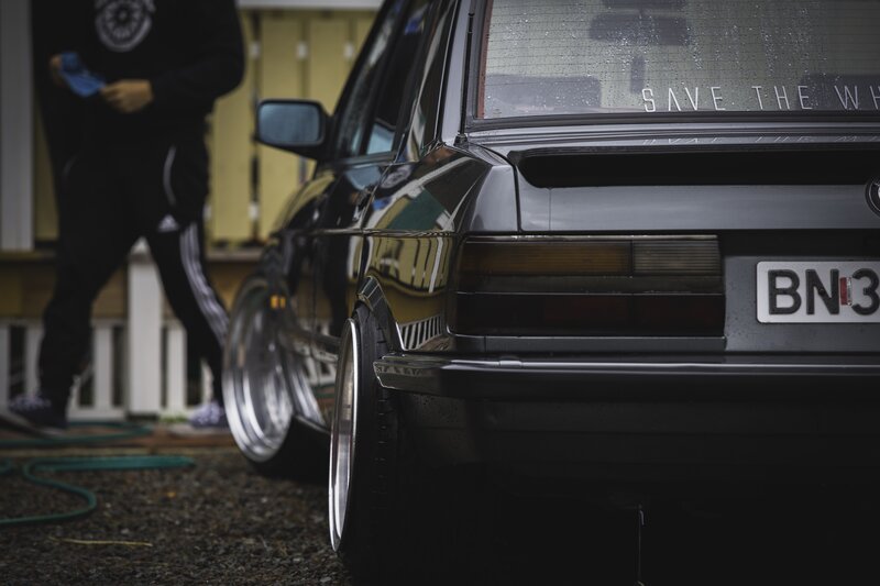 Black Car with Custom Wheels — Dramatic