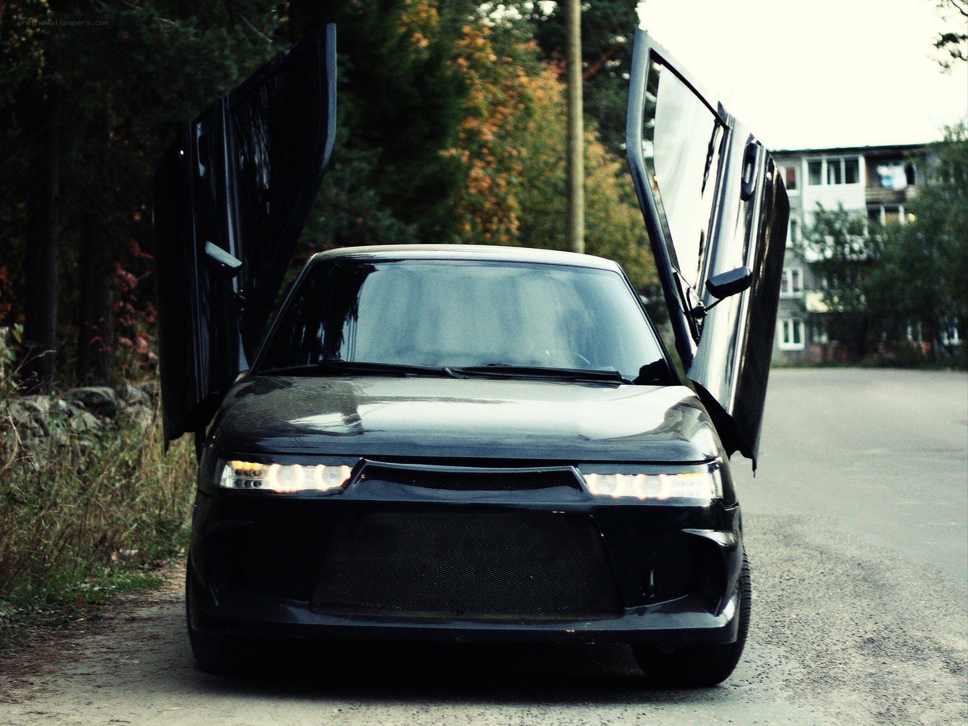 Black car with doors open