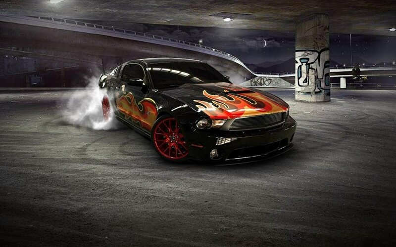Black car with flame decals drifting
