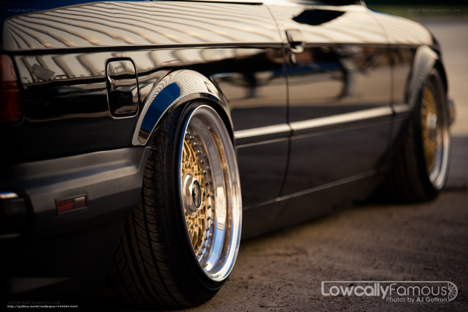 black car with gold wheels