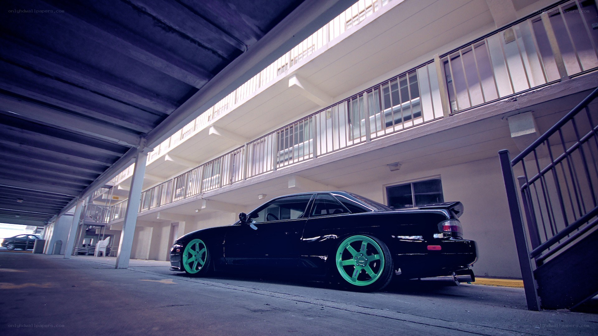 black car with green wheels