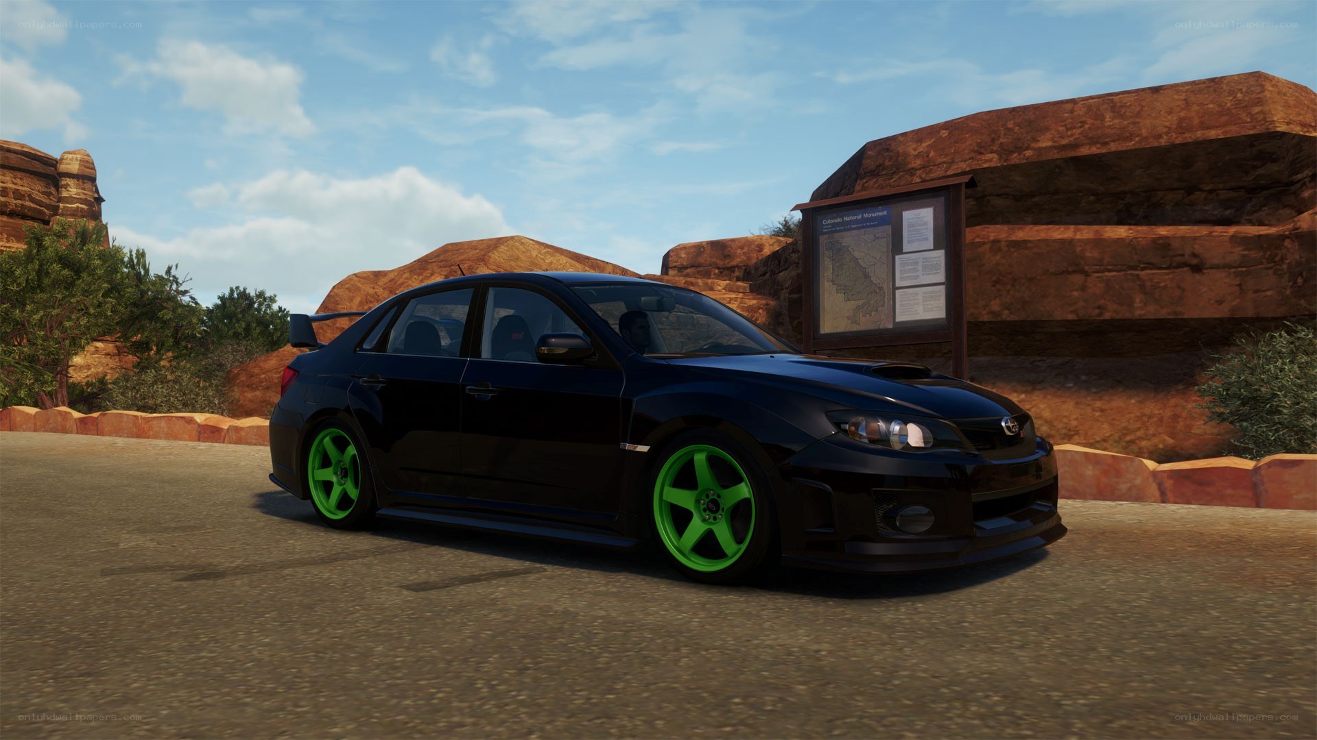 black car with green wheels