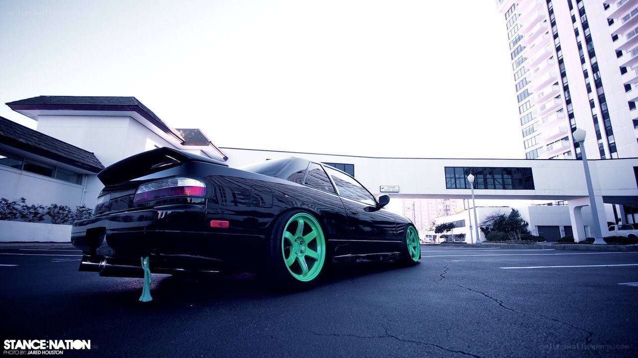 black car with green wheels
