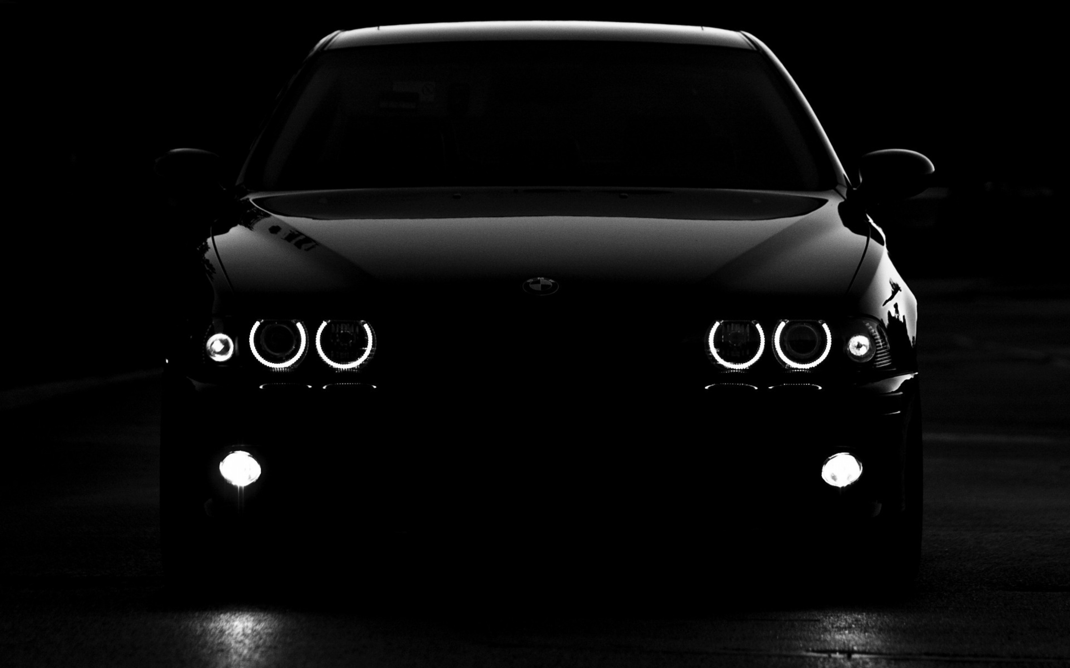 black car with headlights on
