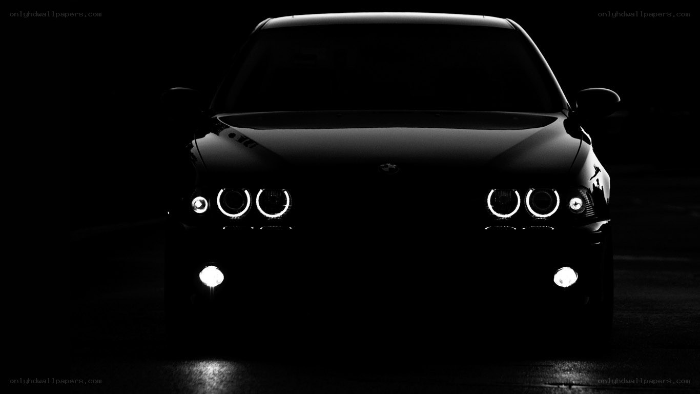 black car with headlights on