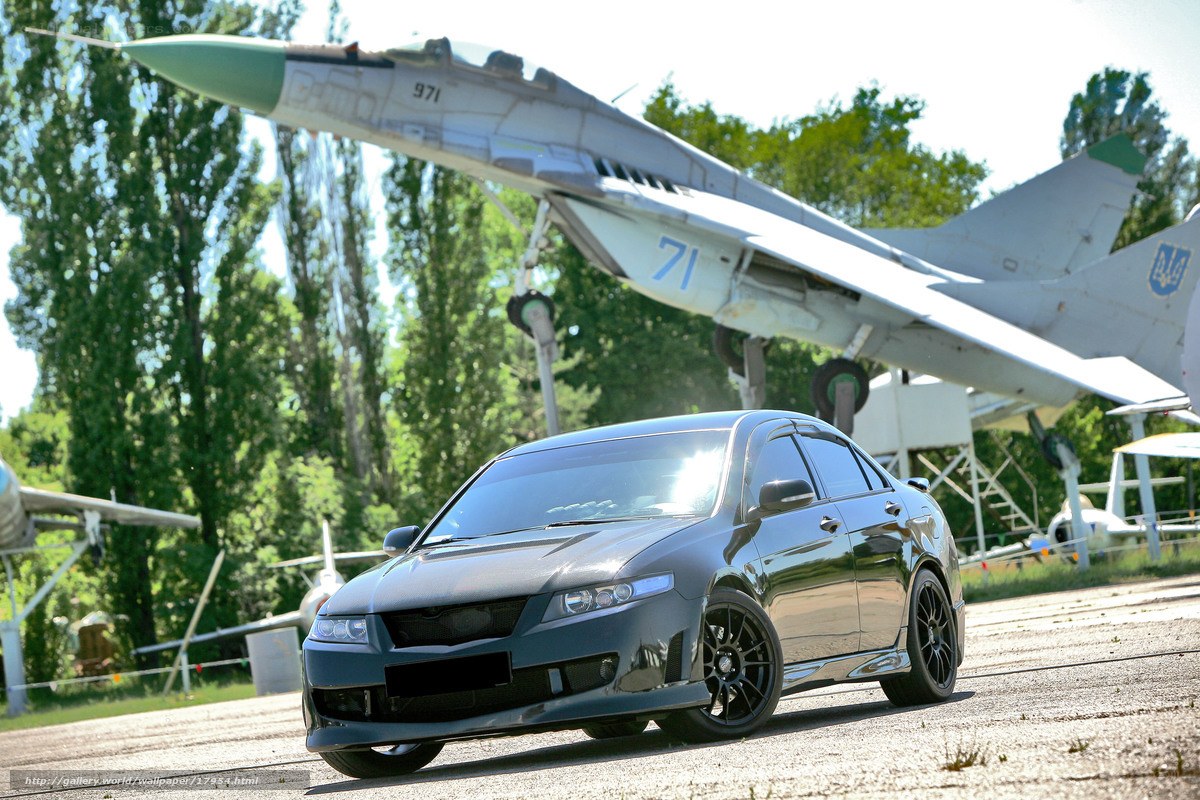 Black car with jet fighter