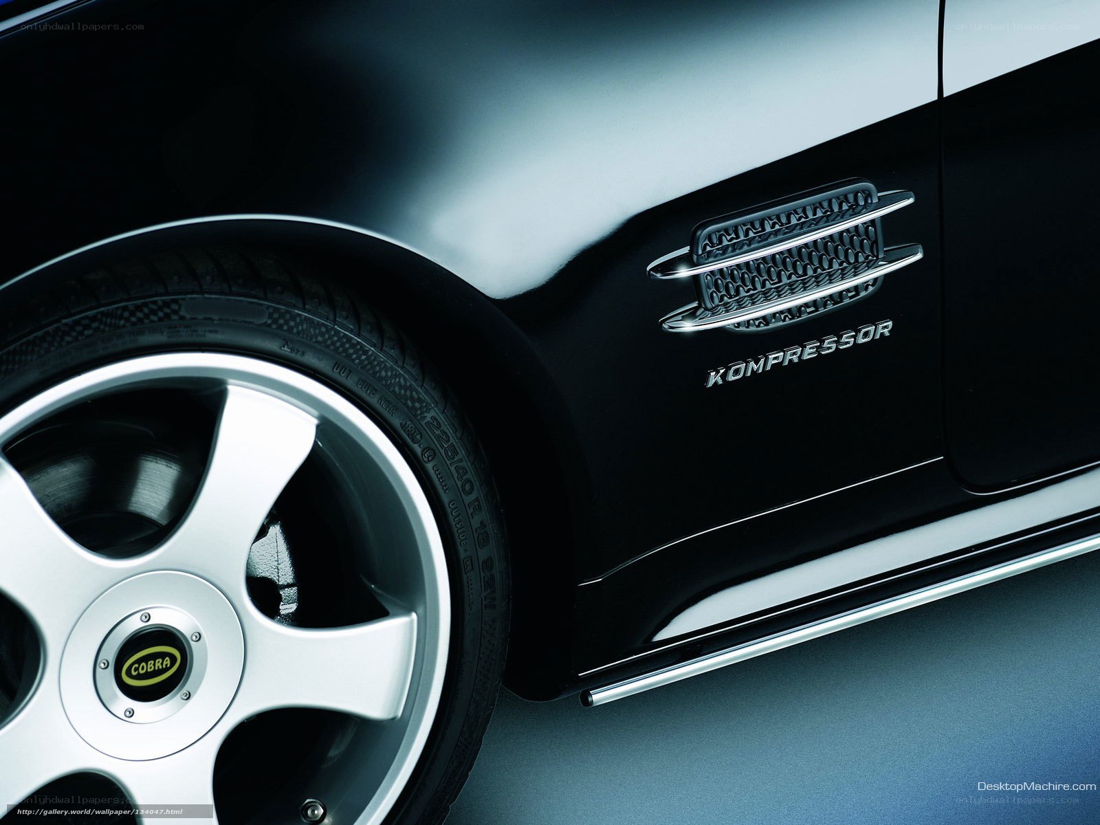 Black car with KOMPRESSOR badge