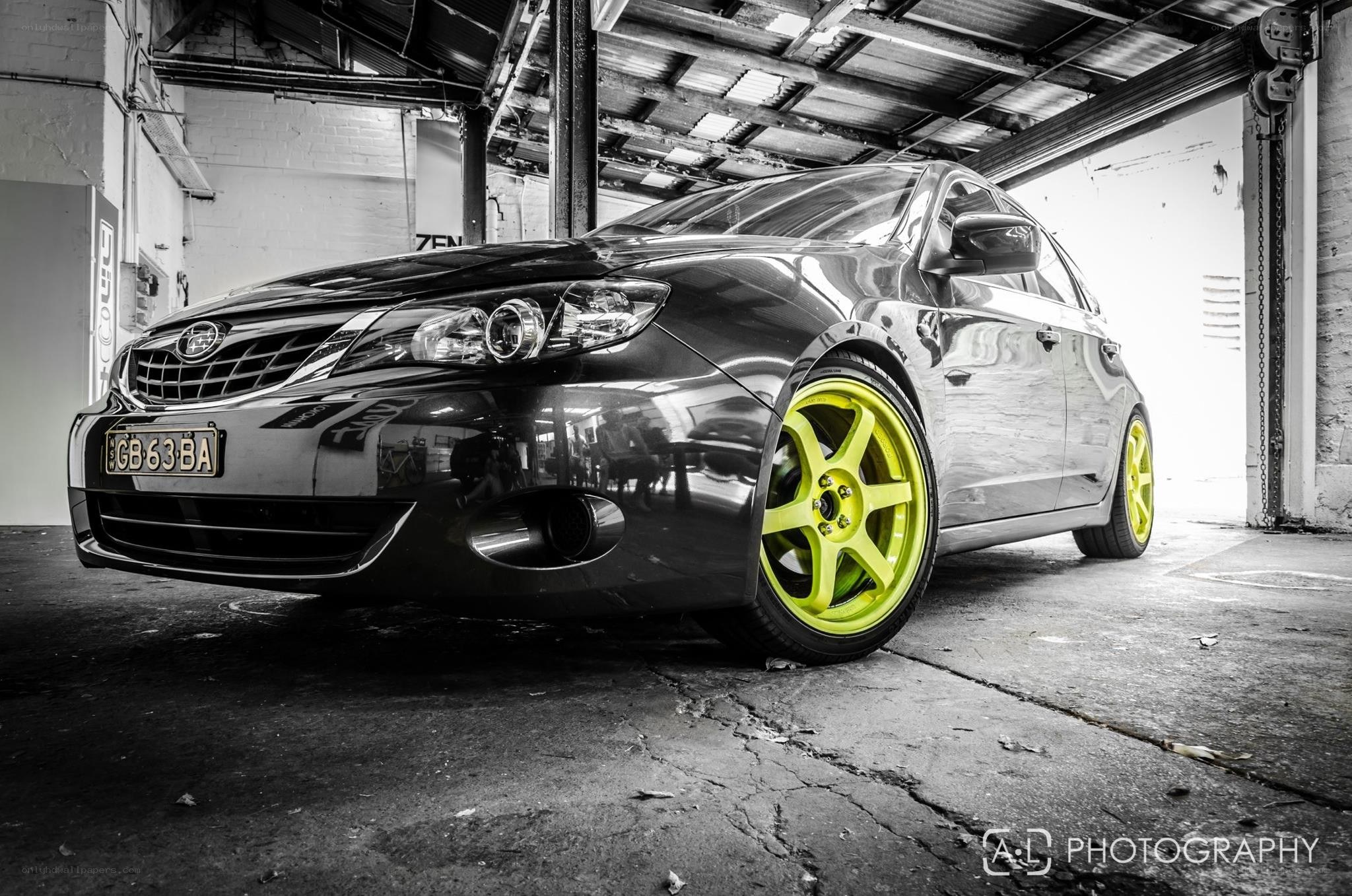 black car with neon wheels