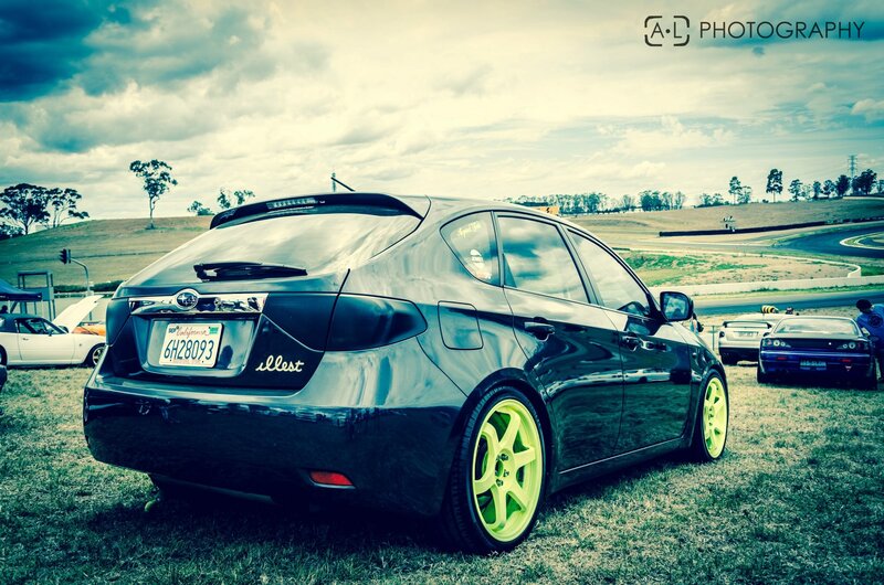 Black car with neon wheels