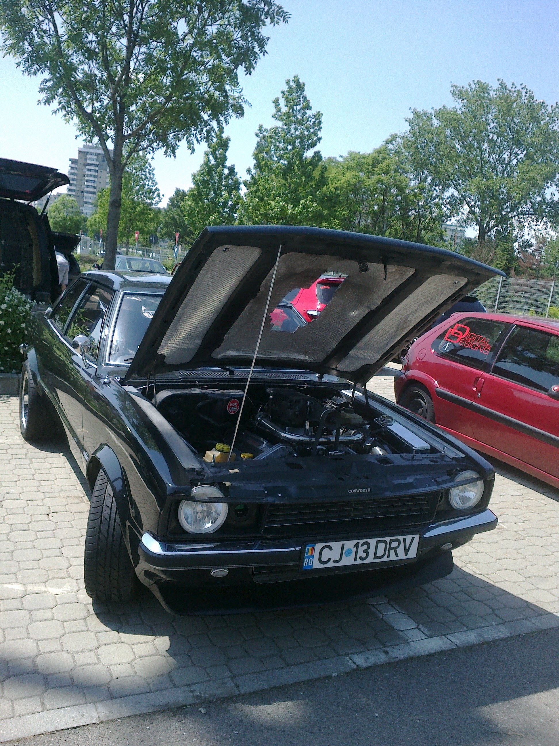 Black car with open hood