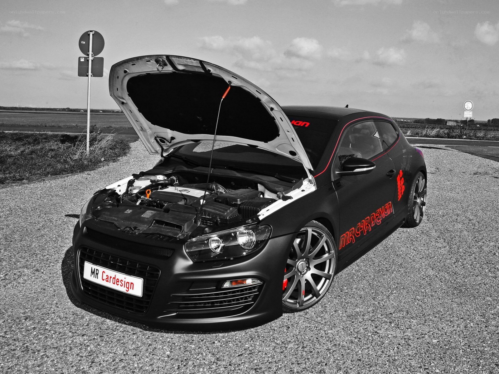 Black car with open hood