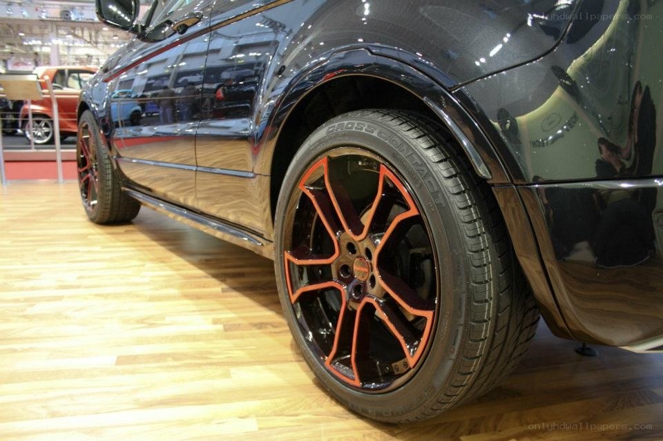 black car with orange rims