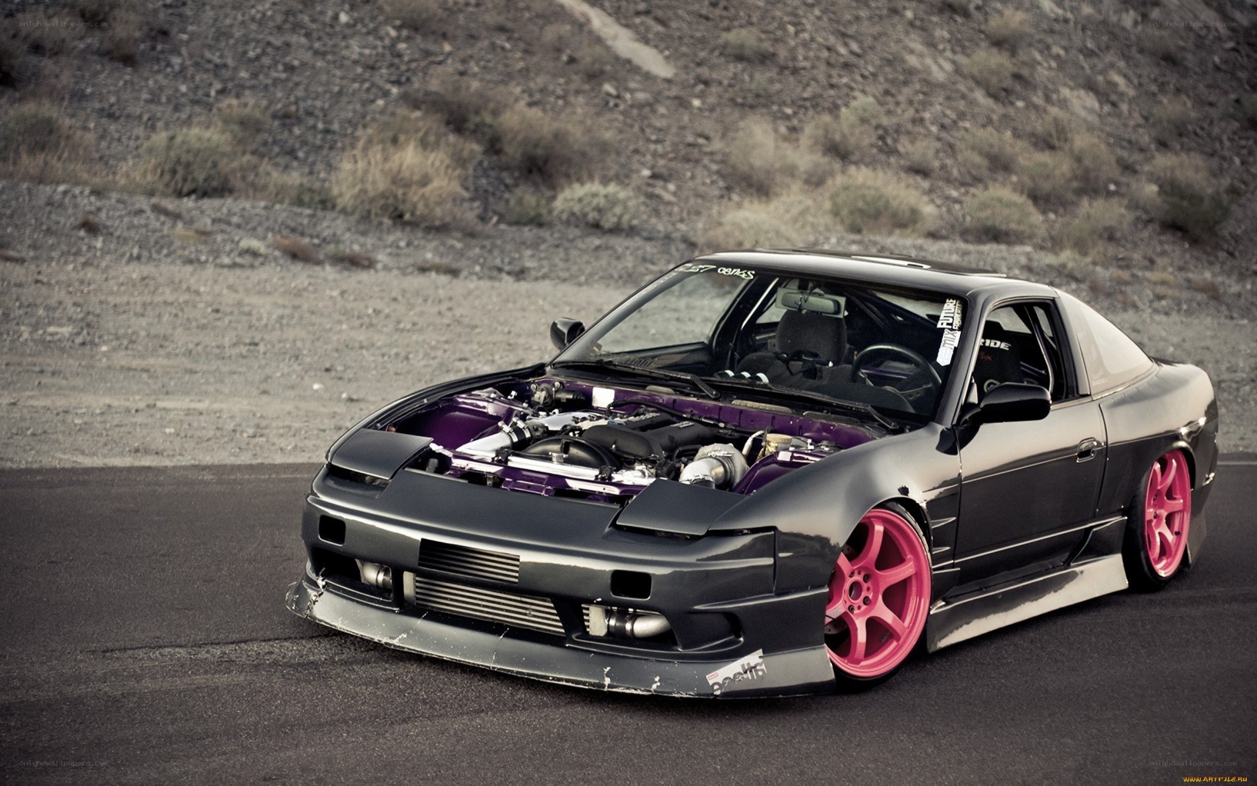 black car with pink wheels