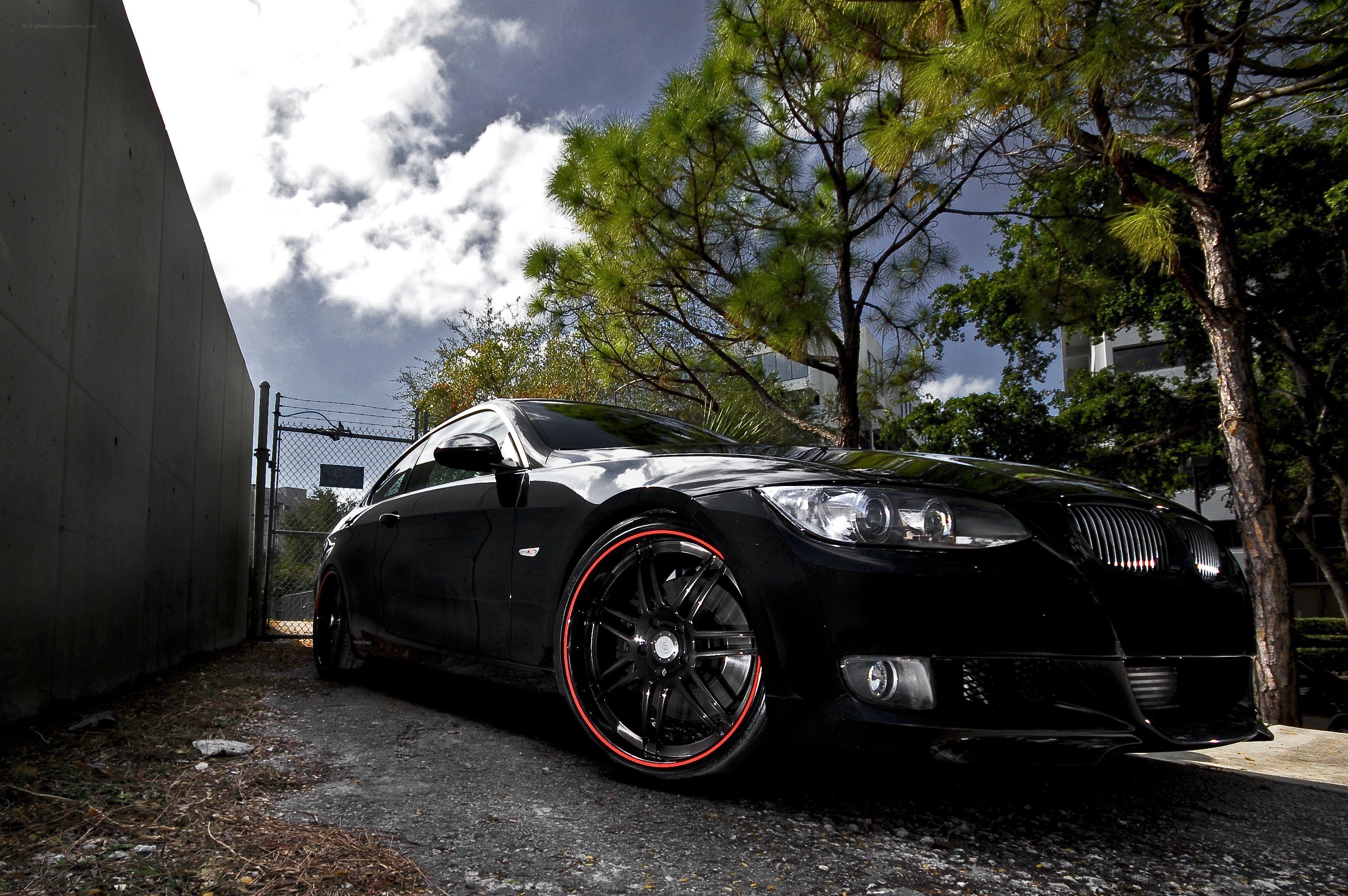 black car with red rims