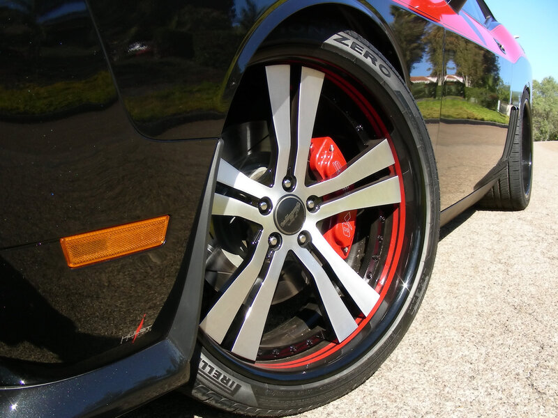 black car with red wheels