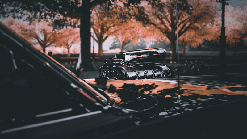 Black Car with Supercharged Engine — Dramatic