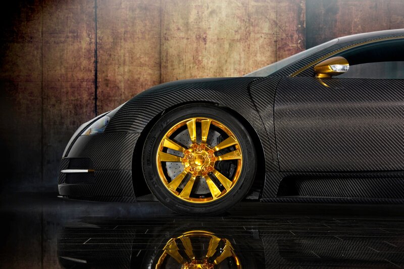 Black carbon fiber car with gold wheels