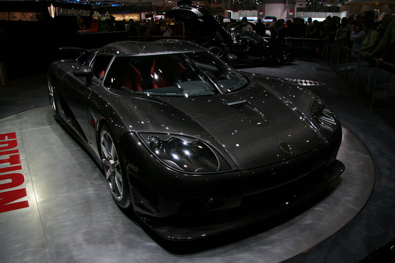 Black carbon-fiber sports car on display
