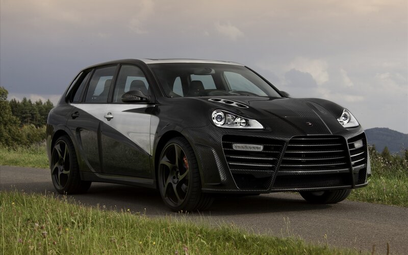 Black carbon-fiber SUV on road