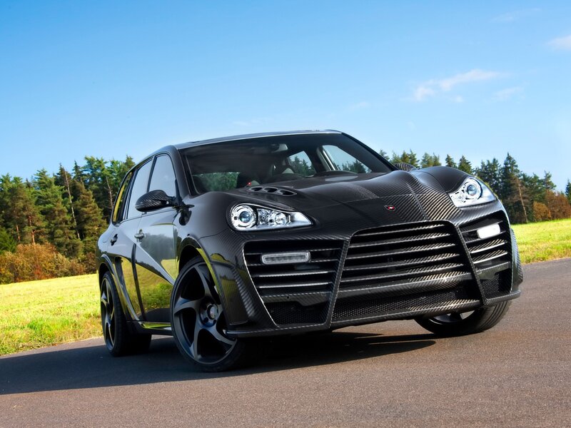 Black carbon-fiber SUV on road