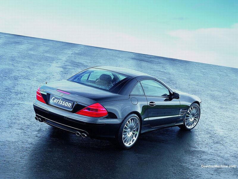 Black Carlsson convertible on wet road
