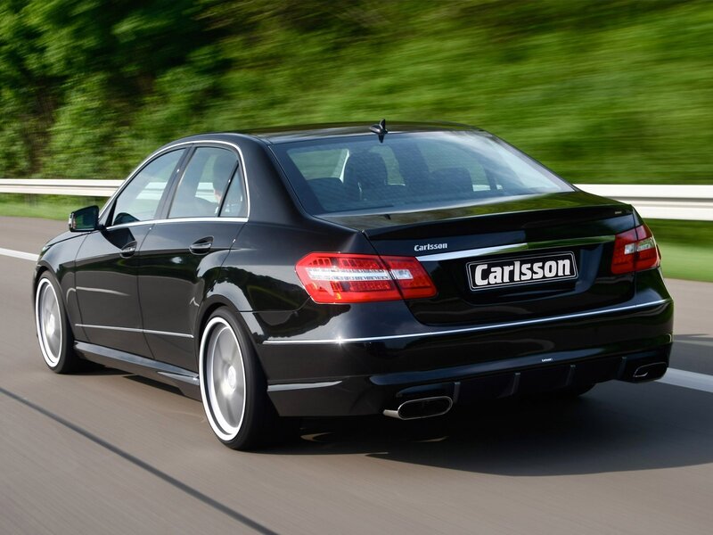 Black Carlsson sedan in motion