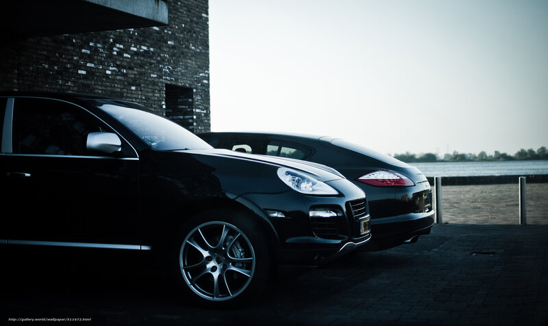 Black cars by the water