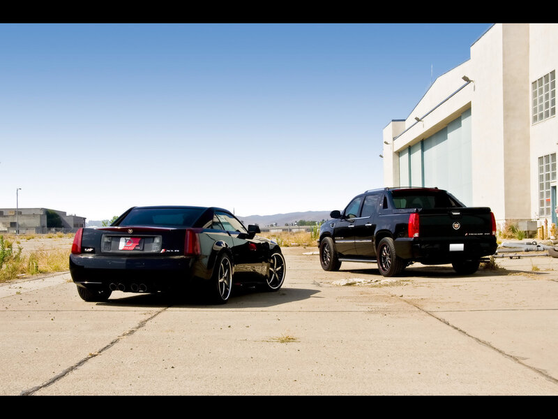 Black cars in industrial lot