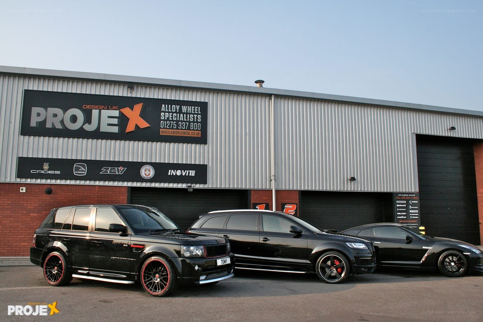 Black cars outside PROJEX