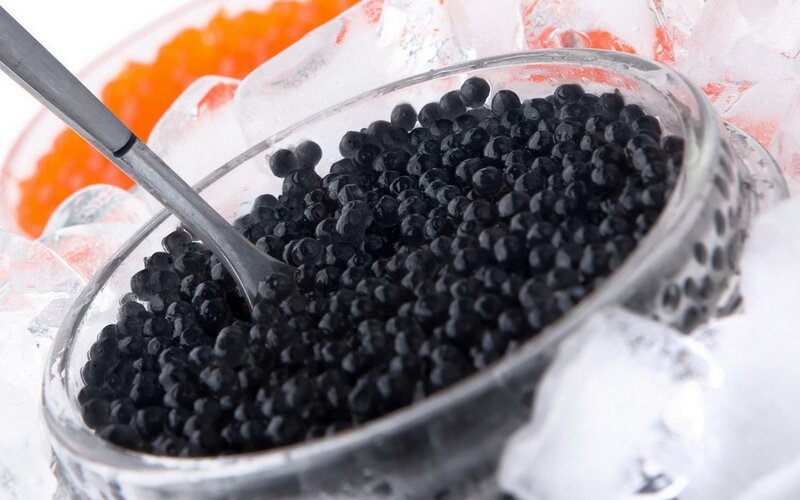Black caviar in a glass bowl