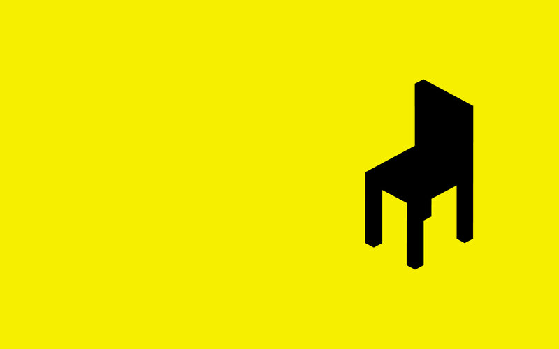 black chair on yellow background