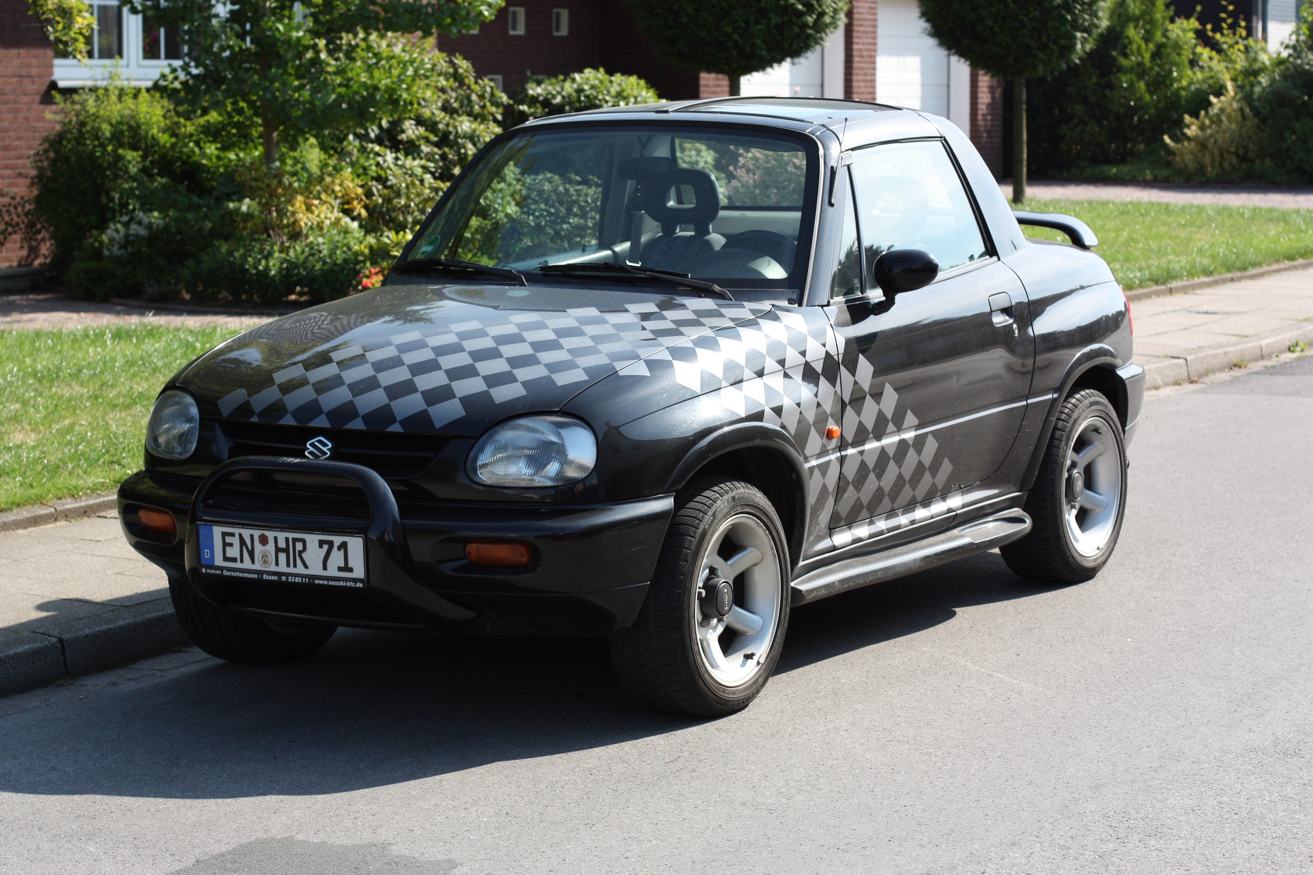 black checkered car on street