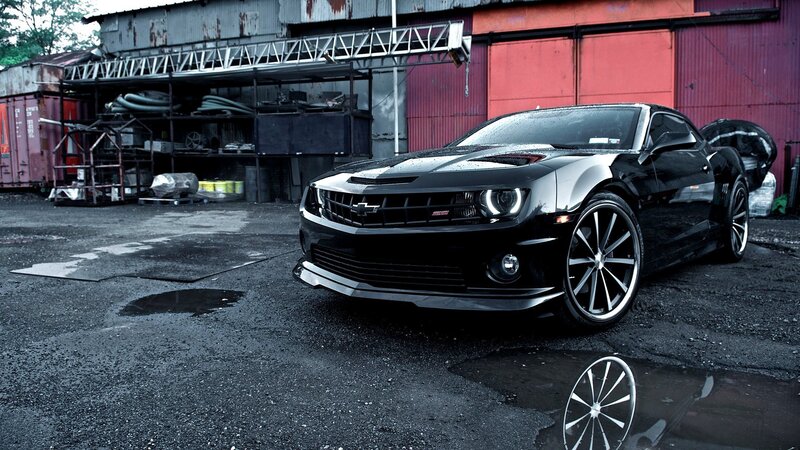 black chevrolet camaro in industrial setting