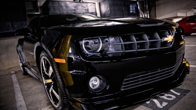 Black Chevrolet Camaro in parking garage