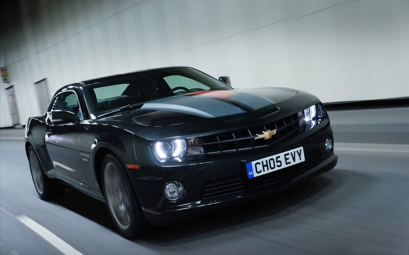 Black Chevrolet Camaro in tunnel