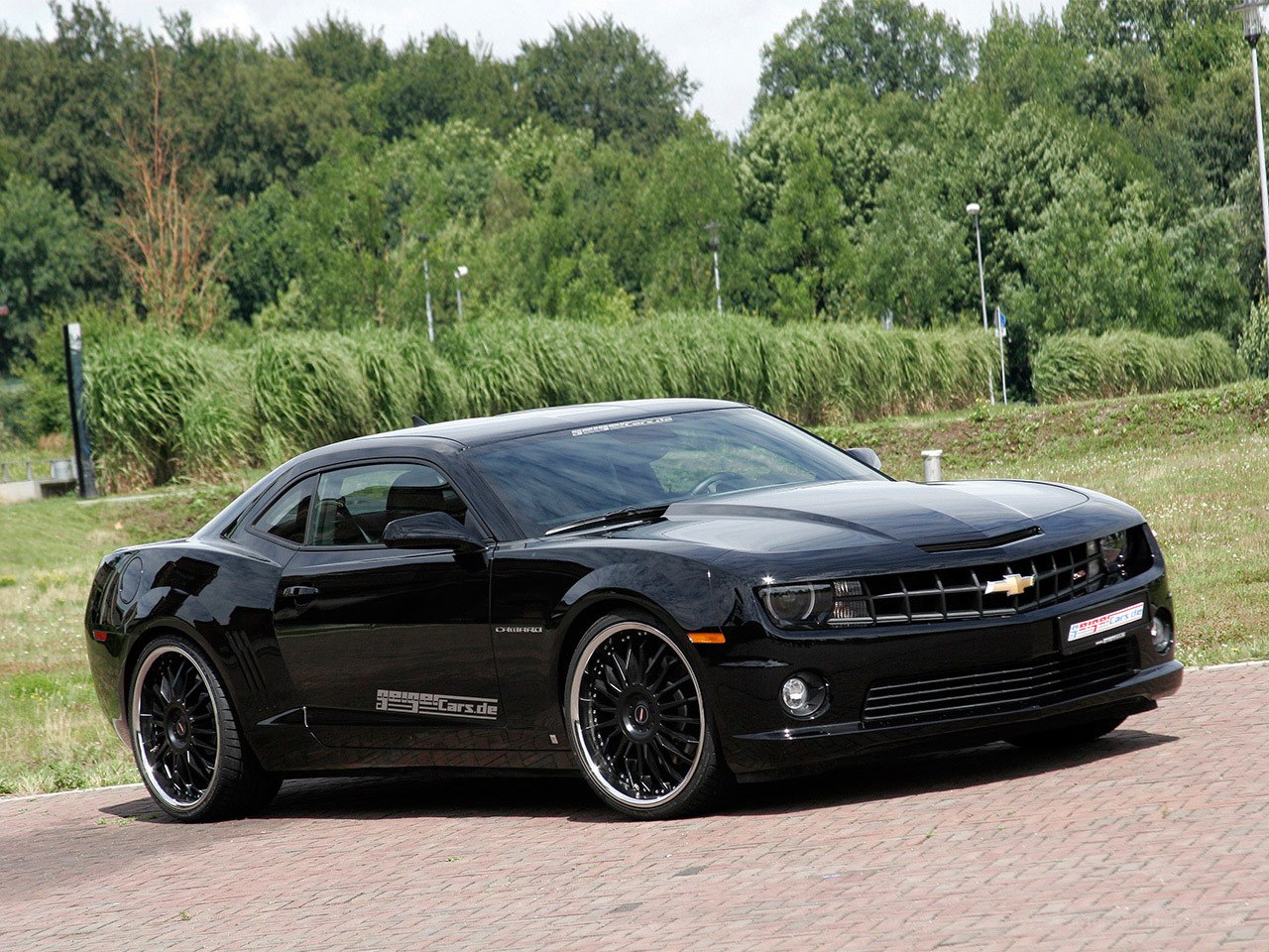 black chevrolet camaro on brick