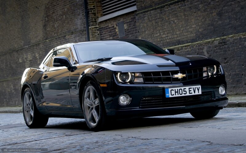Black Chevrolet Camaro on cobblestones