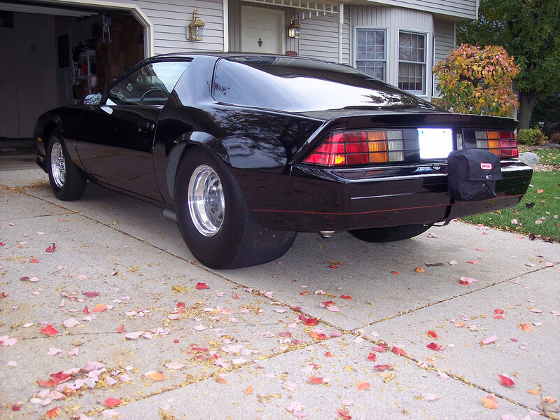 black chevrolet camaro on driveway