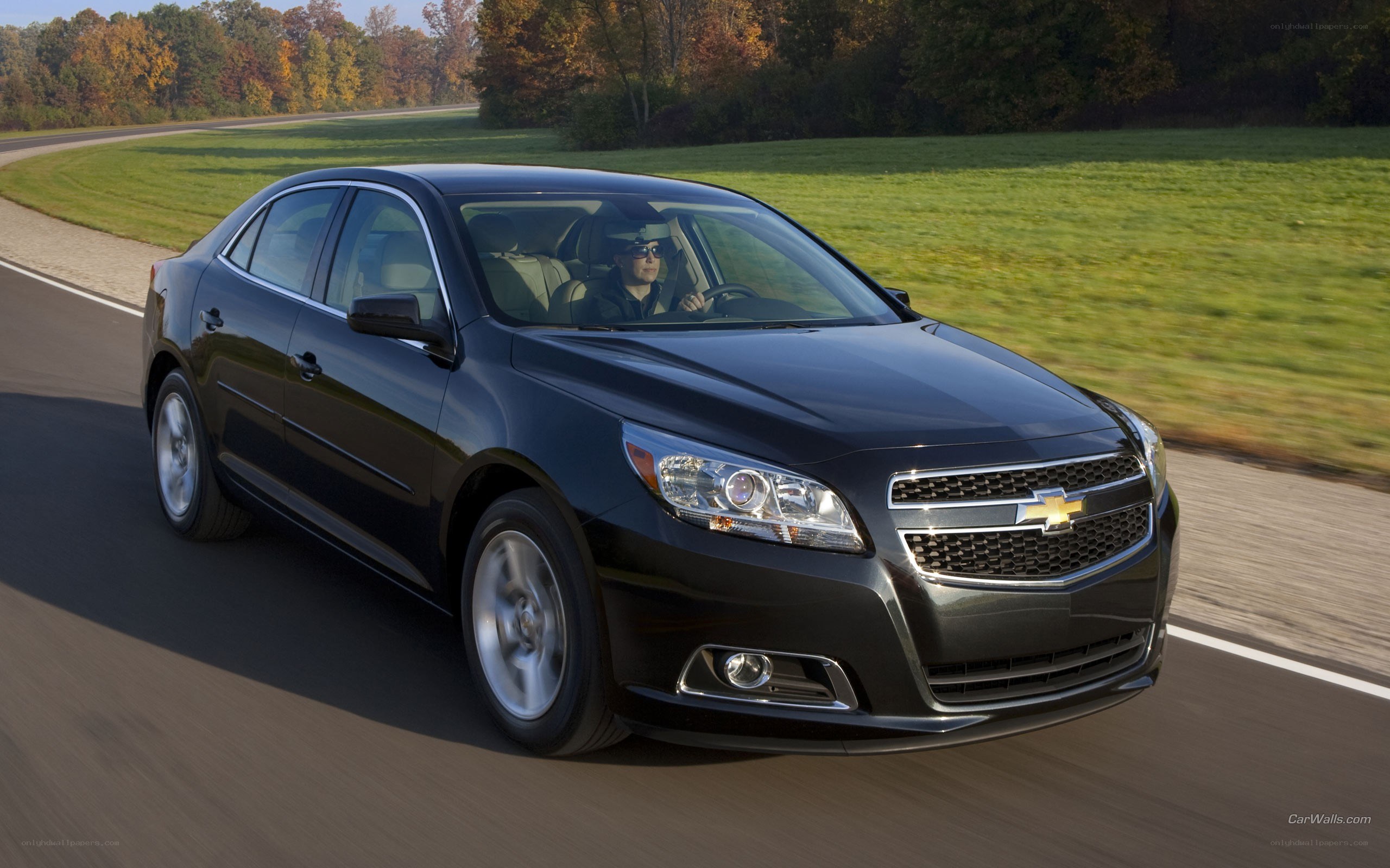 black chevrolet malibu driving