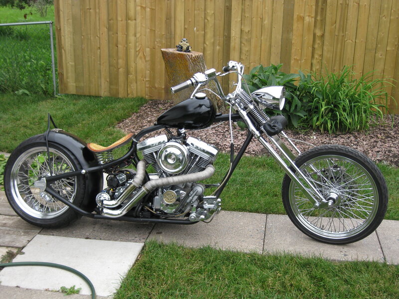 Black Chopper Motorcycle — Calm, Afternoon, Photograph, Grass, Fence