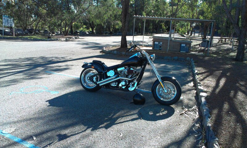 Black Chopper Motorcycle — Calm, Afternoon, Photograph, Parking Lot