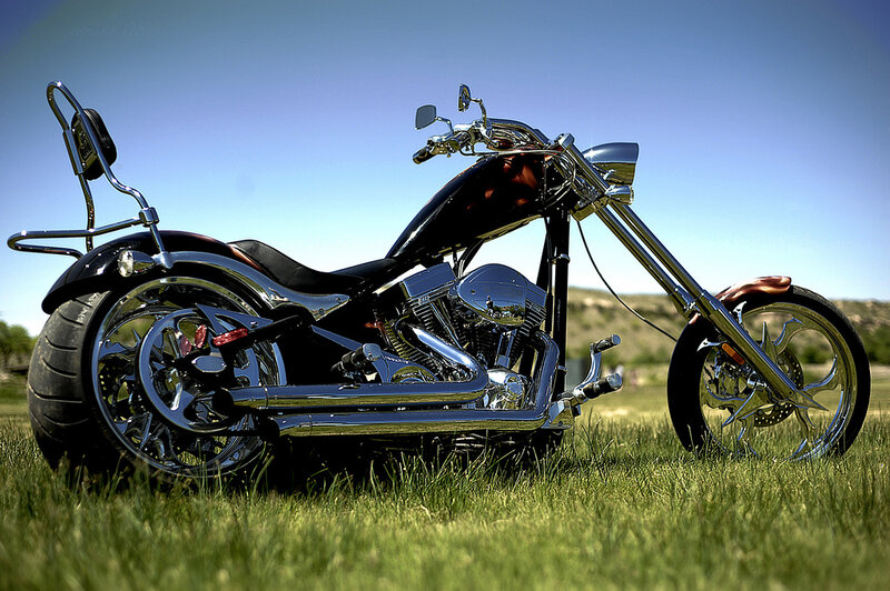 black chopper motorcycle in field
