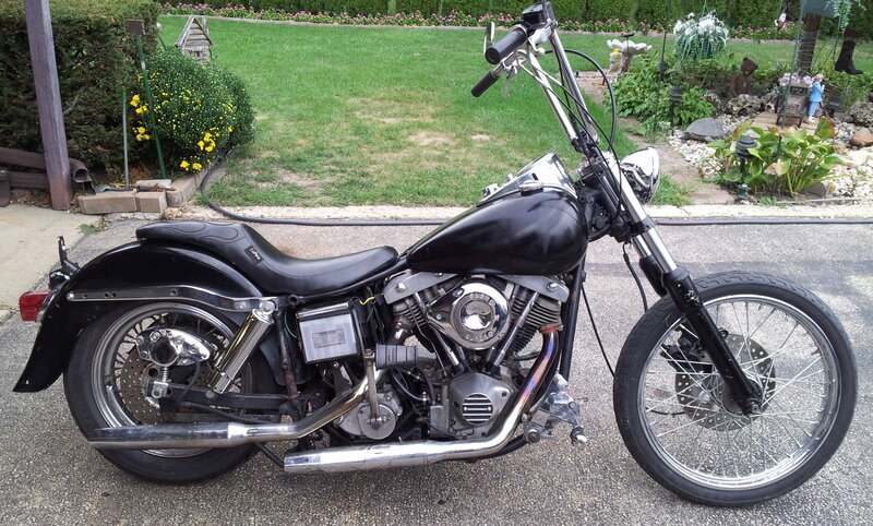 Black Chopper-style Motorcycle — Calm, Afternoon, Photograph, Garden