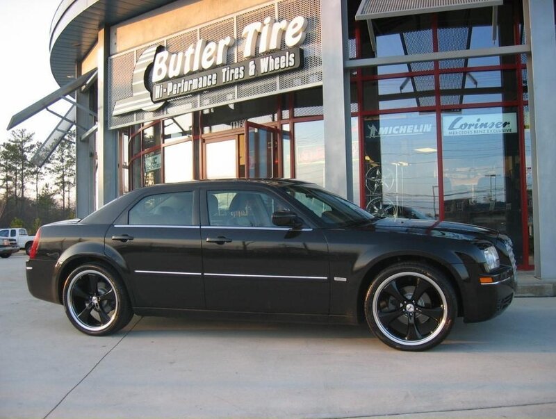 black chrysler 300 at tire shop
