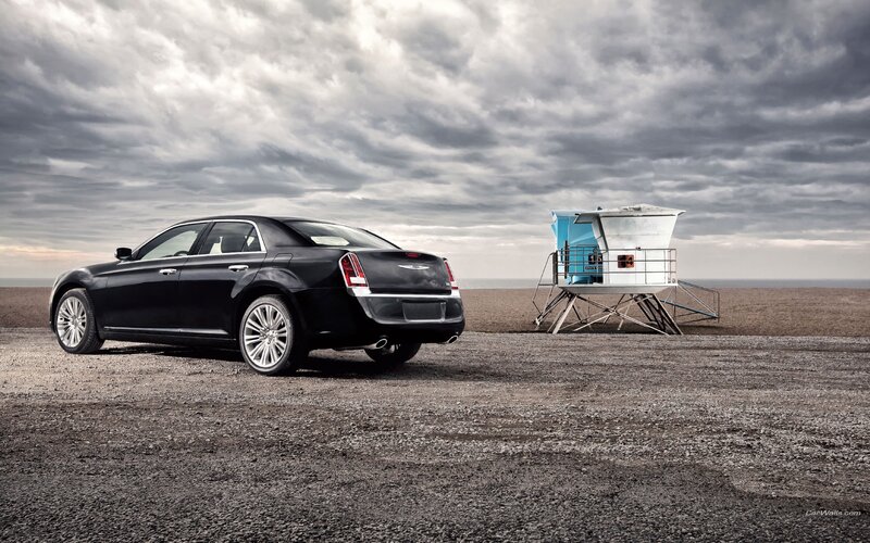 Black Chrysler 300 by the beach