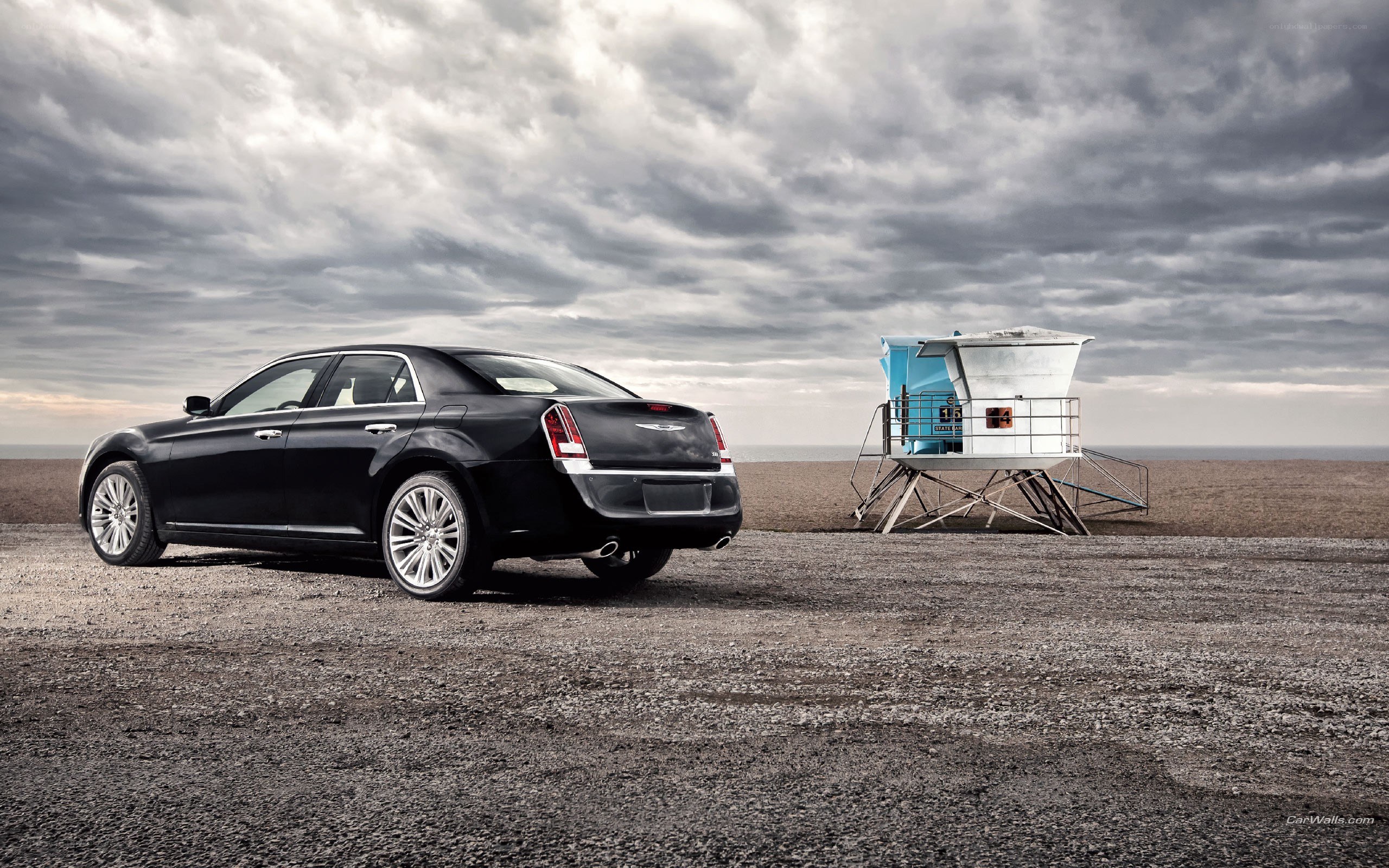Black Chrysler 300 by the beach
