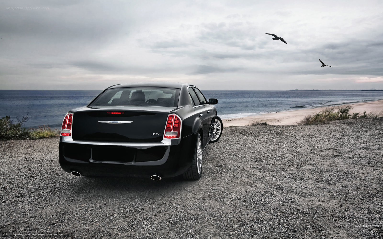 Black Chrysler 300 by the sea