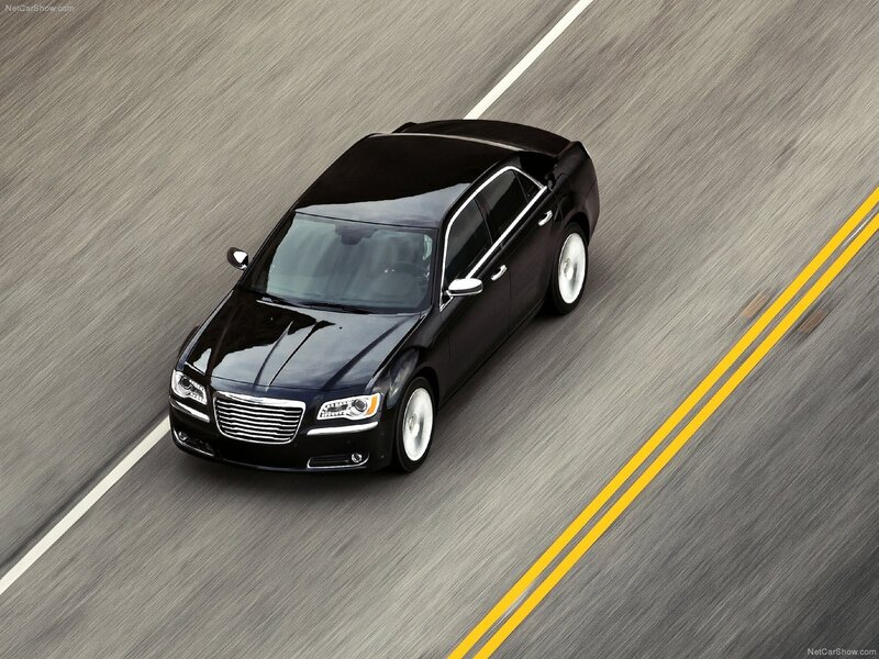 black chrysler 300 driving on road
